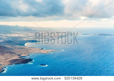 Airplane Aerial View Of Coastal Landscape And Town Oа Arinaga On Gran Canaria Island With Ocean, Hil
