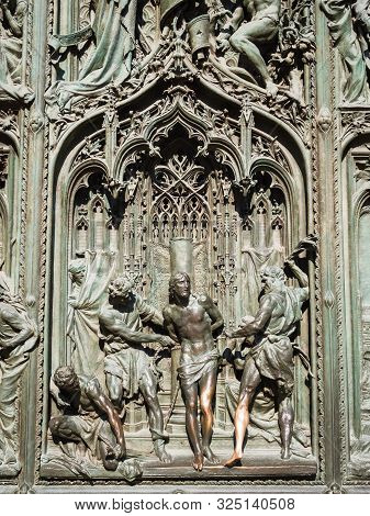 Ornate Detail Of The Bronze Door Of Milan Catehdral In Italy