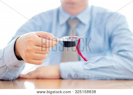 A Businessman Hold Cap Eudcation Concept. University.