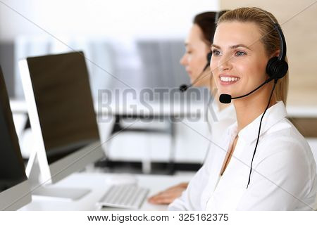 Call Center. Happy And Excited Business Woman Using Headset While Consulting Clients Online. Custome