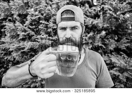 His Drinking Choice. Hipster Drinker. Hipster Holding Beer Mug. Bearded Hipster Drinking Beer On Nat