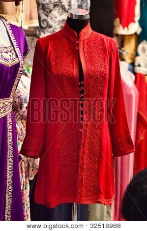 Djellaba - traditional long, loose-fitting femaleÃ?ÃÂ¢??s outer robe, for sailing on market in Marrakesh