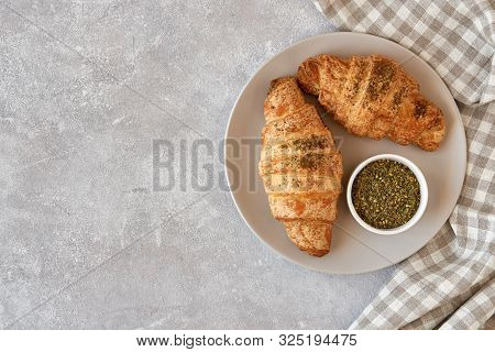 Fresh Croissants With Zaatar  On Light Stone Background. Top View
