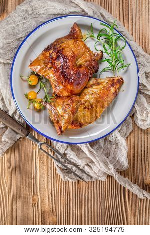 Chicken Quarters Baked On Plate. Top View.