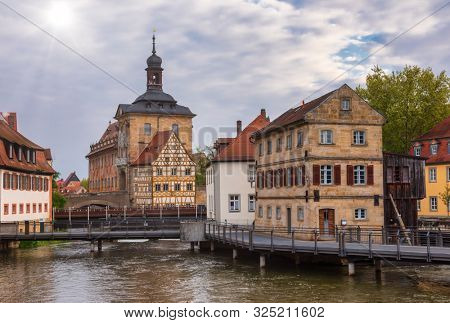 Bamberg cityscape with the medieval Altes Rathaus (Old Town Hall) and stone bridge  over the Regnitz river, Bavaria, Germany, Europe. Bamberg is one of most popular travel destinations in Germany