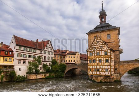 Bamberg cityscape with the medieval Altes Rathaus (Old Town Hall) and stone bridge  over the Regnitz river, Bavaria, Germany, Europe. Bamberg is one of most popular travel destinations in Germany