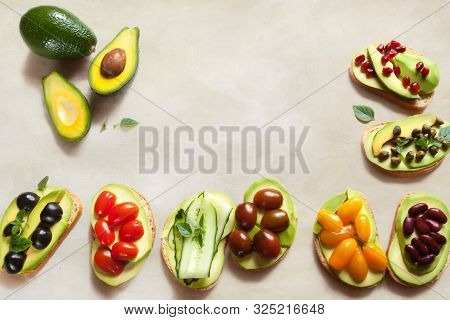 Vegetarian Avocado Sandwich On White Beeswax Wraps Paper With Fresh Sliced Avocados And Vegetables T