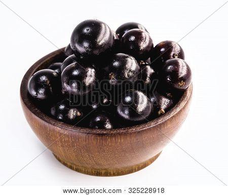 Jaboticaba In A Basket On A White Background. The Jaboticaba Or Jabuticaba Is A Purplish Black-white