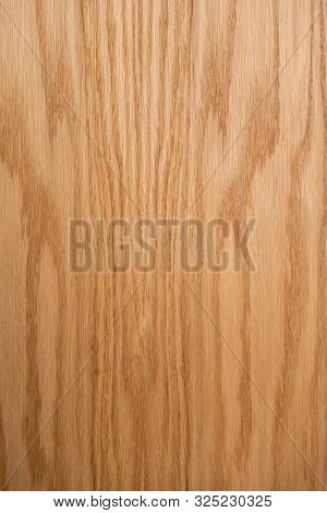 Oak Plank. The Structure Of Natural Oak. A Tangential Cut Of A Tree Trunk. Brown Natural Background.