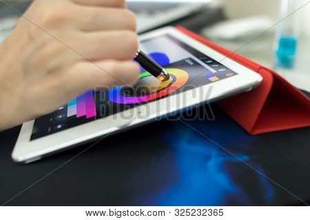 Person About To Draw Something On A Tablet.