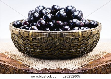Fruit Called Jaboticaba Or Jabuticaba In A Basket On A White Background, Preserves Organic And Healt