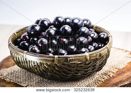 Fruit Called Jaboticaba Or Jabuticaba In A Basket On A White Background, Preserves Organic And Healt