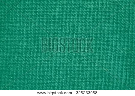 Coarse Woven Canvas In A Green Hue. Cotton Texture. Macro. Color Name: Tropical Rain Forest. Flat La