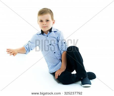 Cute Little Boy Studio Portrait On White Cyclorama. The Concept Of A Happy Childhood. Isolated On Wh