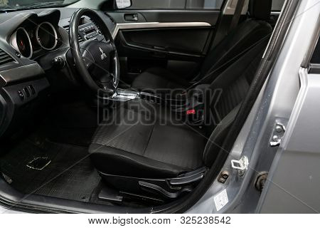 Novosibirsk, Russia - September 07, 2019:  Mitsubishi  Lanser, Black Luxury Car Interior - Steering 