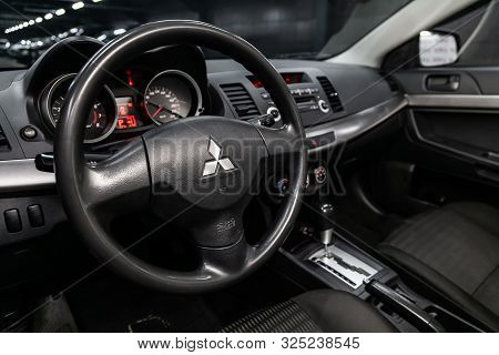 Novosibirsk, Russia - September 07, 2019:  Mitsubishi  Lanser, Black Luxury Car Interior - Dashboard