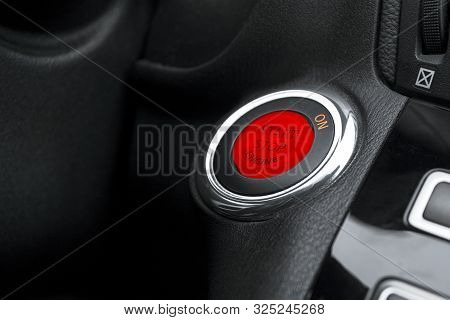 Car Dashboard With Focus On Engine Start Stop Button. Modern Car Interior Details. Start/stop Button