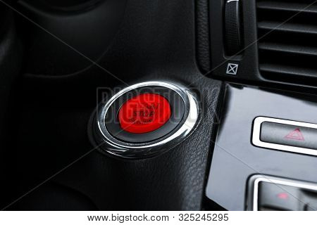 Car Dashboard With Focus On Engine Start Stop Button. Modern Car Interior Details. Start/stop Button