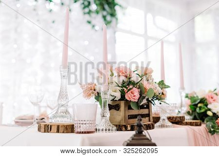 Pink Candles In Tall Glass Candlesticks And Flowers In A Wooden Little Box