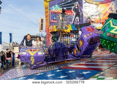 Munich, Germany, 2019 September 28: Visitors Enjoy On An Amusement Park Ride. Breakdancer Fun Ride, 
