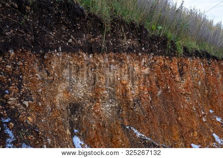 The Curb Erosion From Storms. To Indicate The Layers Of Soil And Rock. Nature Cross Section Soil Und
