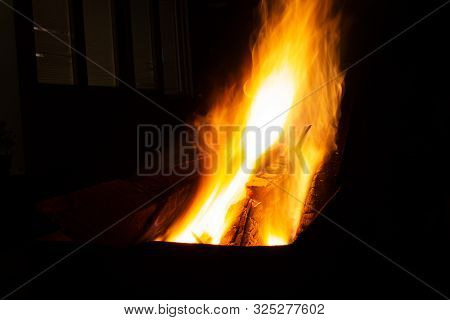 The Fire Burns In The Grill At Night. Bright Fire, Wood. The Flames On The Night