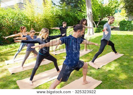 Young People Practicing Yoga. Full Length View Of Young Barefoot People In Sportswear Standing In Yo
