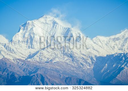 Beautiful View Of The Landscape Of The Himalayan Mountains. Snow-covered Mountain Peaks. Trekking Co