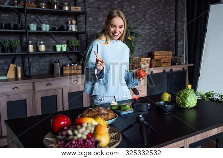 Young Beautiful Blonde Takes On Videos As She Cooks In The Kitchen