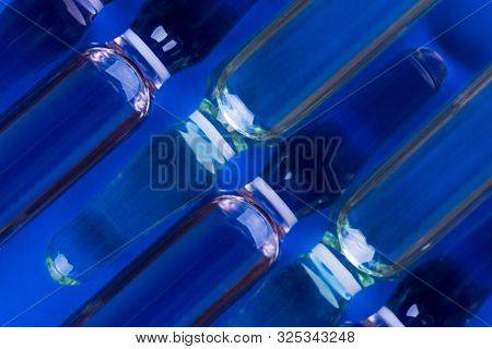 Ampoules Neatly Folded To Each Other. Ampules Close Up. Glass Ampoules.