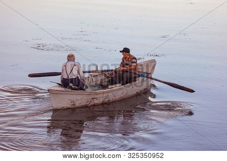Poti, Georgia - 01.09.2019: A Litte Boat And The Fishermen On The Lake In Paliastomi. Poti.