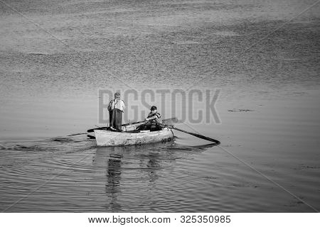 Poti, Georgia - 01.09.2019: A Litte Boat And The Fishermen On The Lake In Paliastomi. Poti.
