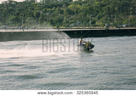 Aqua Sport On A Jet Ski, An Athlete Performs Various Exercises On The Water.