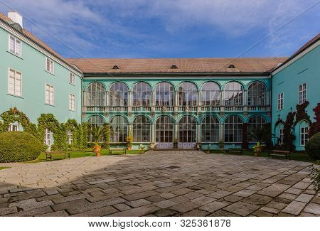 Dacice, Czech Republic - September 29 2019: View Of Square Courtyard And Green Facade Of A State-own