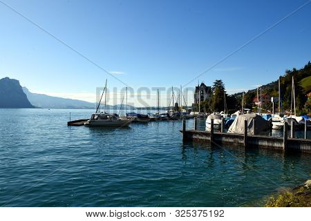 Vitznau, Switzerland 29.09.2019: Sailing Boats Resting In The Port Of Vitznau On Lake Lucerne With V