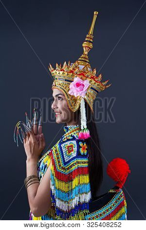 The Beautiful Woman Wearing Thai Southern Folk Dancing Costume,made From Colorful Bead,and The Headd