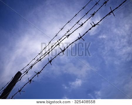 The Silhouette Barbwire Stacked In Line,on Sky Background,abstract And Art Tone