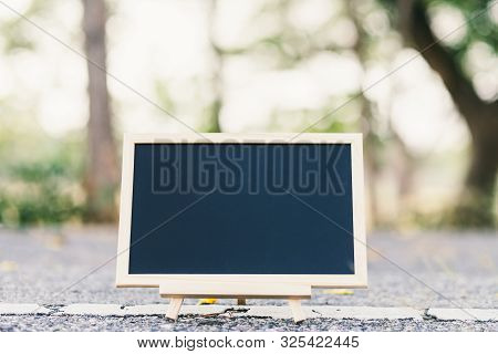 Empty Wooden Blackboard And Sphalt Road Texture In Square Shape On Road Surface In The Park Backgrou