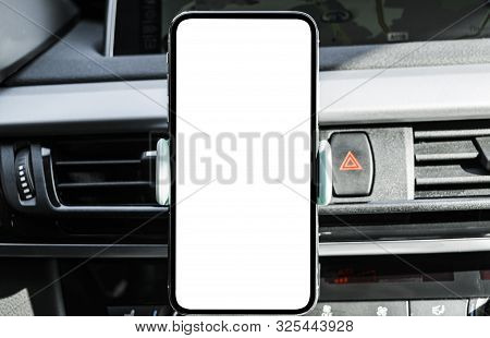 Smartphone In A Car Use For Navigate Or Gps. Driving A Car With Smartphone In Holder. Mobile Phone W