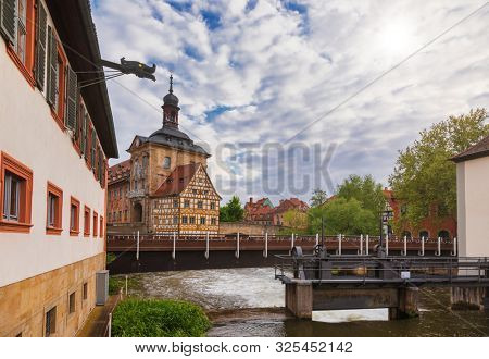 Bamberg cityscape with the medieval Altes Rathaus (Old Town Hall) and stone bridge  over the Regnitz river, Bavaria, Germany, Europe. The medieval centre of the city is a UNESCO World Heritage Site.
