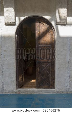 Old Wooden Door, Entrance To The Building From The Street.