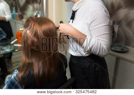 Young Blonde Attractive Woman Visiting Hairdresser. Health And Beauty. Close-up Of Hair Dryer, Conce
