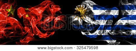 China Vs Uruguay, Uruguayan Smoke Flags Placed Side By Side. Thick Colored Silky Smoke Flags Of Chin