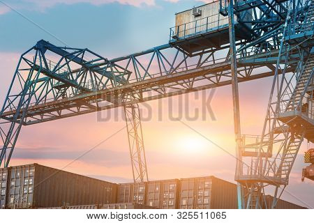 Large Industrial Port Crane Unloads Cargo Containers