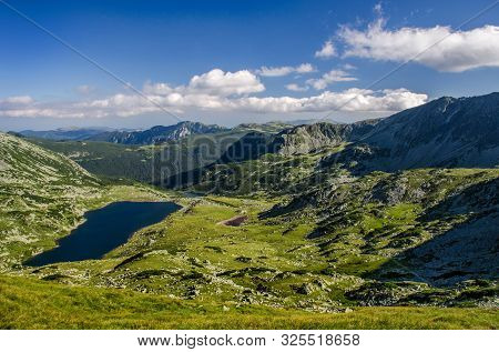 Mountain Landscape And Glacial Bucura Lake In Retezat National Park, Carpathian Mountains, Romania