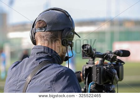 Professional Videographer Shoots On Camera. Video Shooting Of The Event.