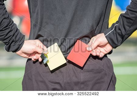 The Football Referee Is Going To Show The Card.