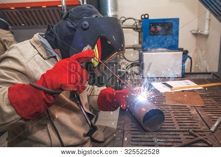 Working Welder Welds The Parts. Electric Welding.