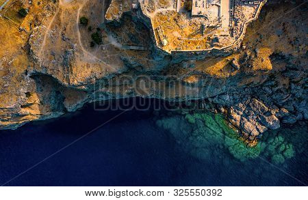 Aerial Birds Eye View Photo Taken By Drone Of Iconic Acropolis Of Village Of Lindos, Rhodes Island, 