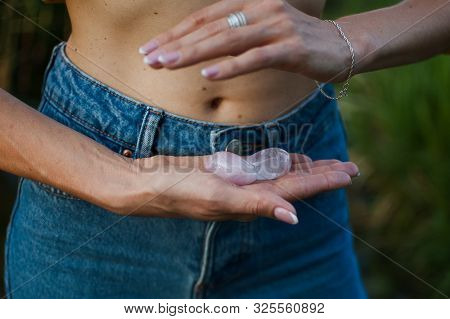 Adult Woman Is Holding Two Yoni Eggs For Vumfit, Imbuilding Or Meditation Are Made From Pink Quartz 